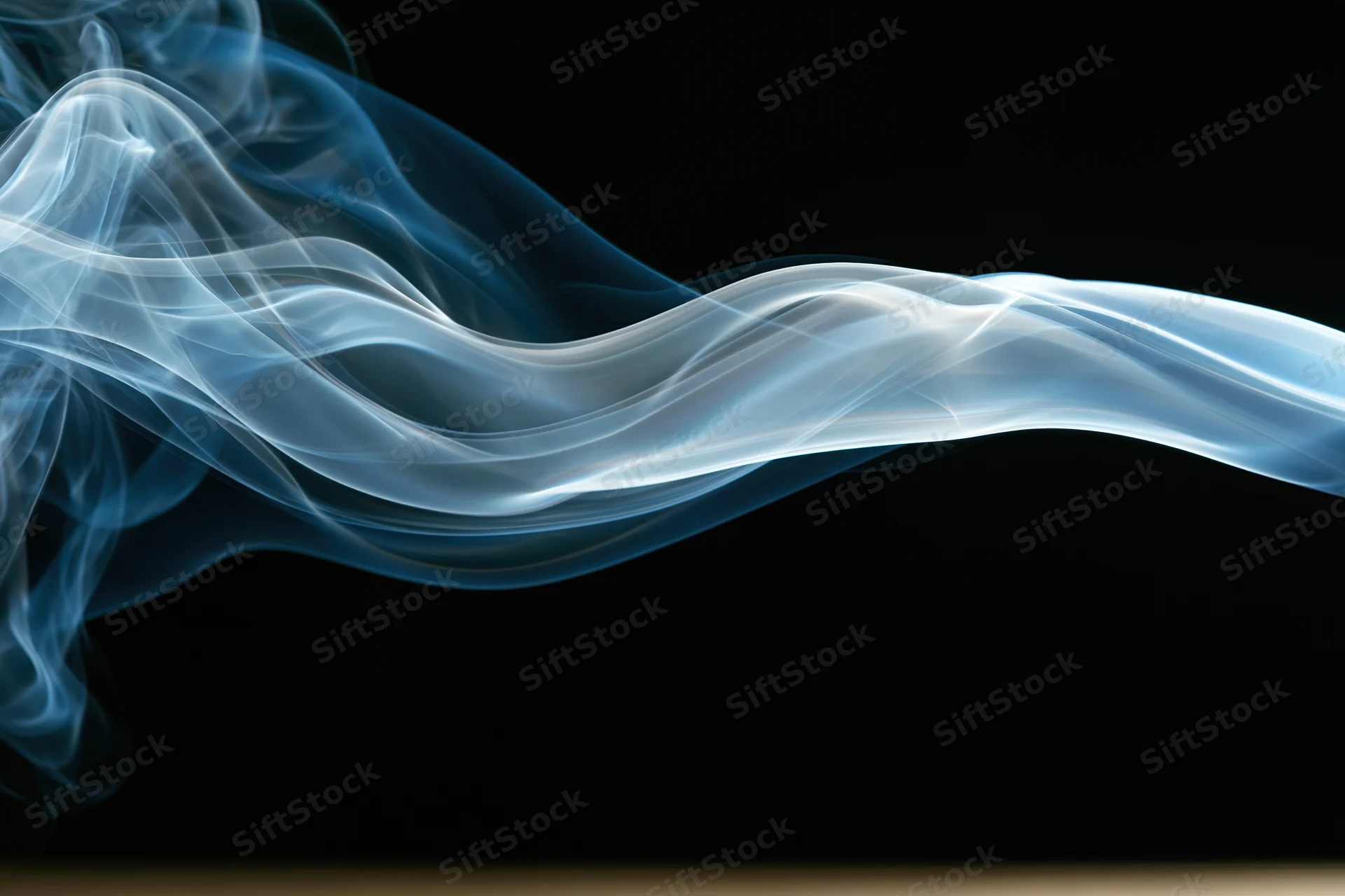 A wisp of white and blue smoke swirling horizontally against a black background