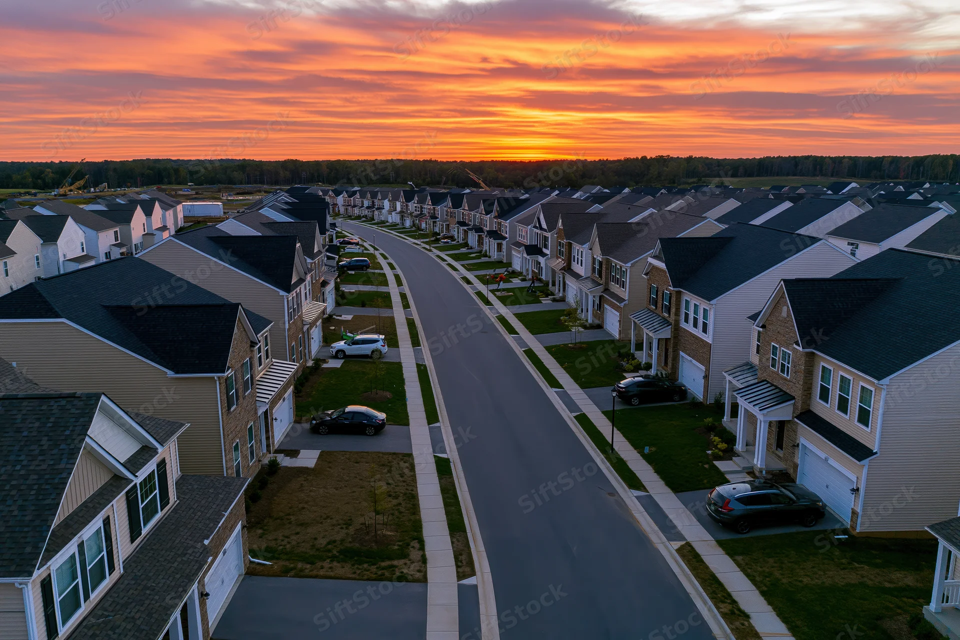 Aerial view of a new suburban residential development at sunset
