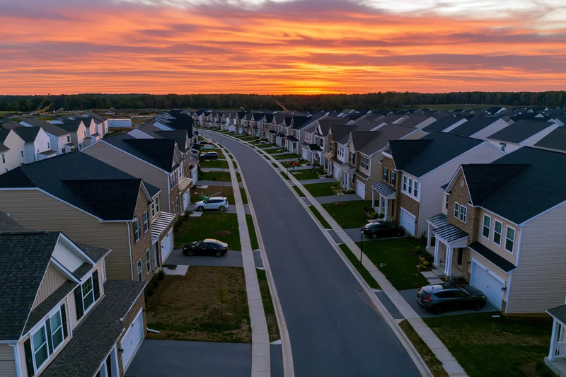 Aerial view of a new suburban residential development at sunset