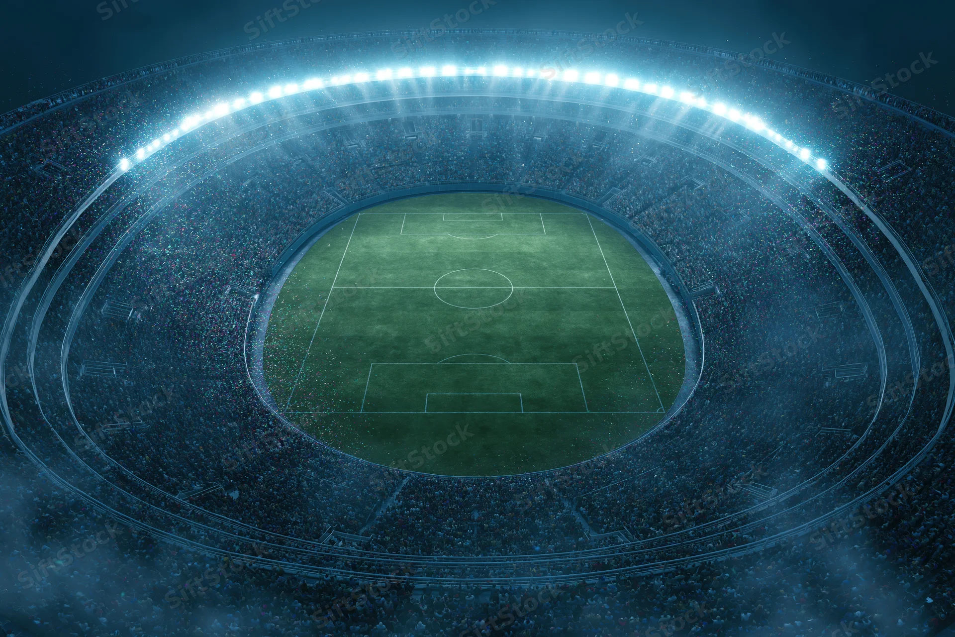 Aerial top-down view of a packed soccer stadium at night with illuminated field and crowd