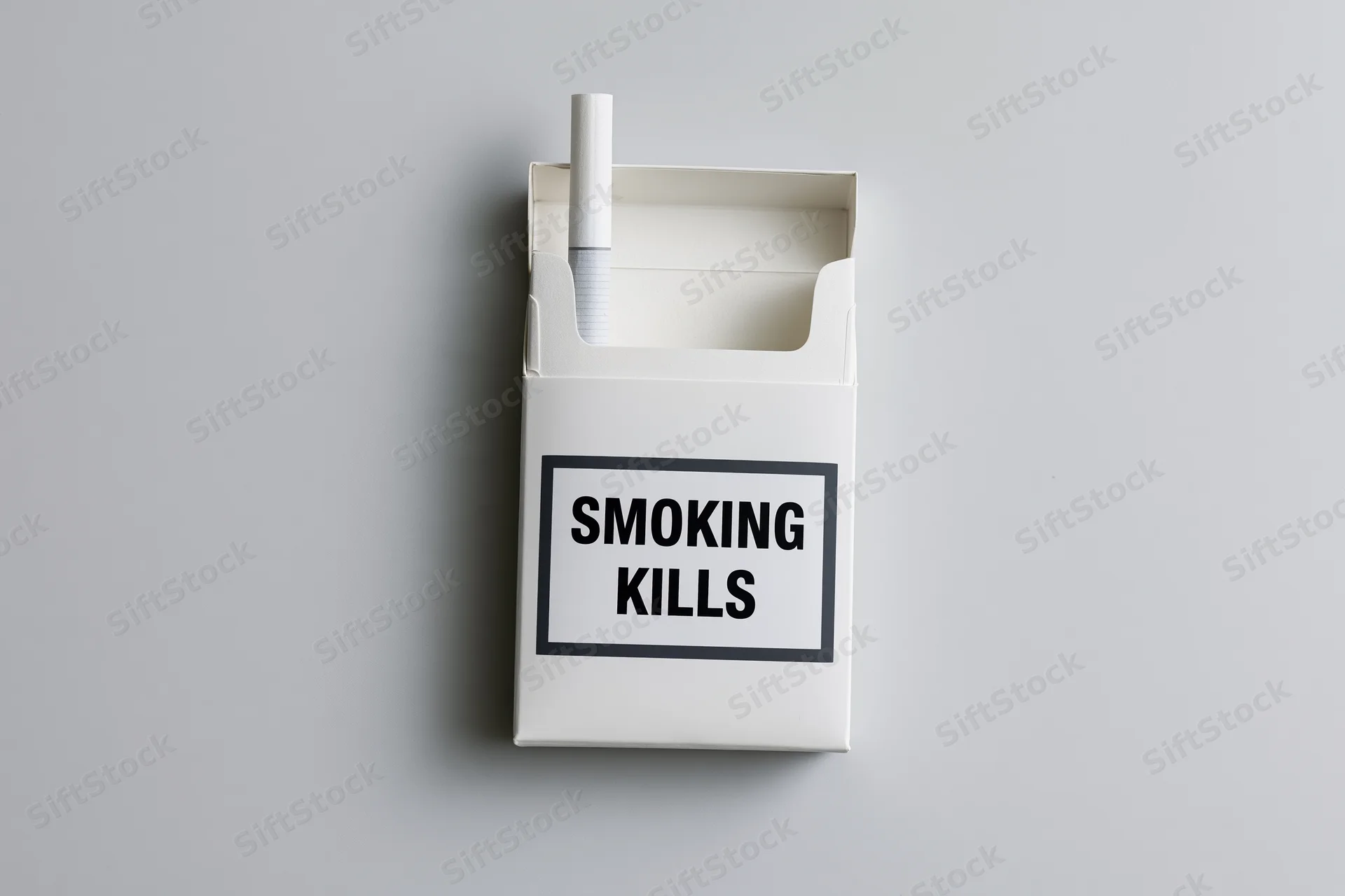 Open white cigarette pack with one cigarette sticking up and smoking kills warning label on plain gray background