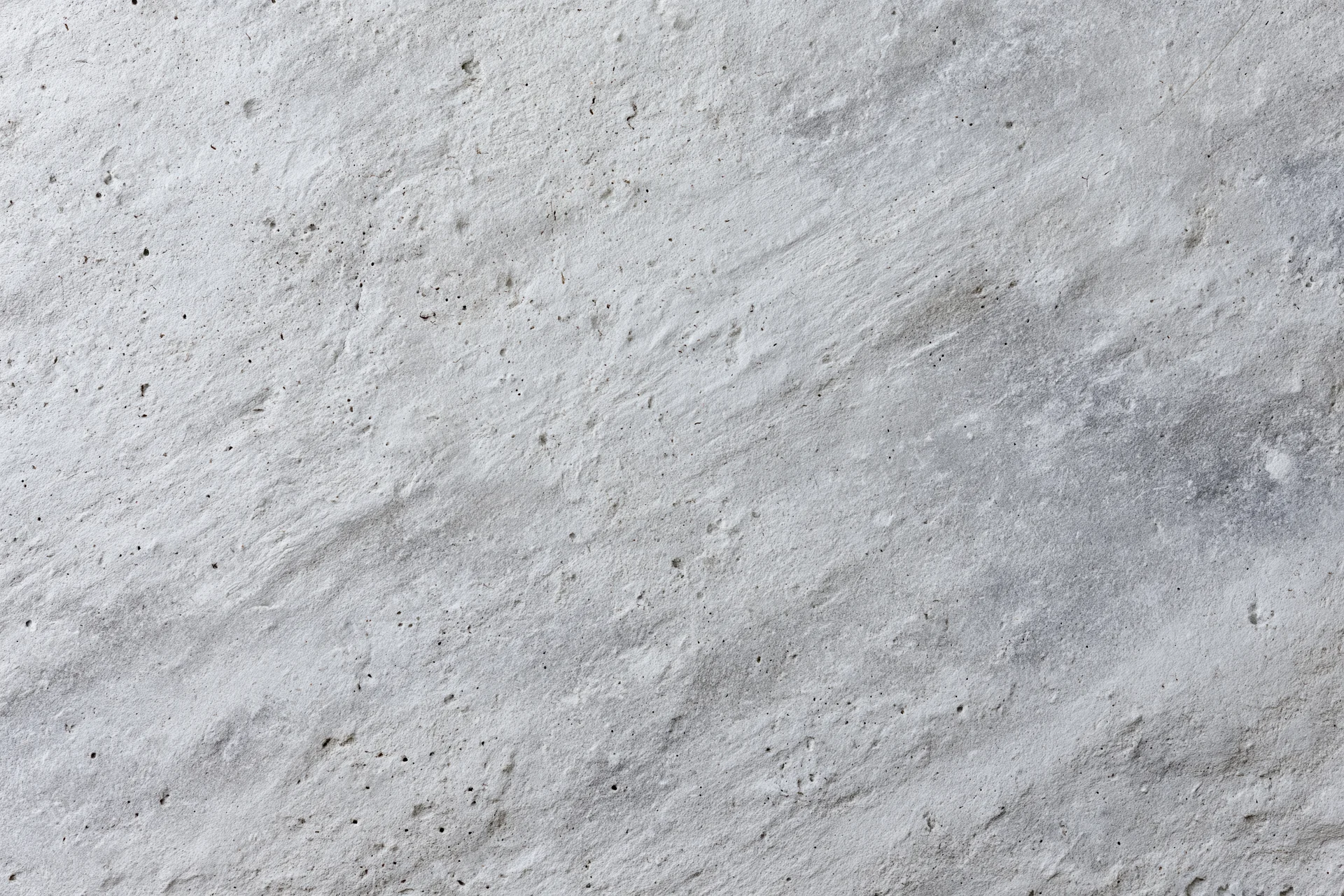 Closeup of a rough gray concrete wall surface filling the frame