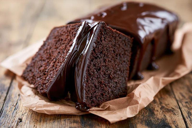 Chocolate loaf cake covered in glossy dark chocolate ganache
