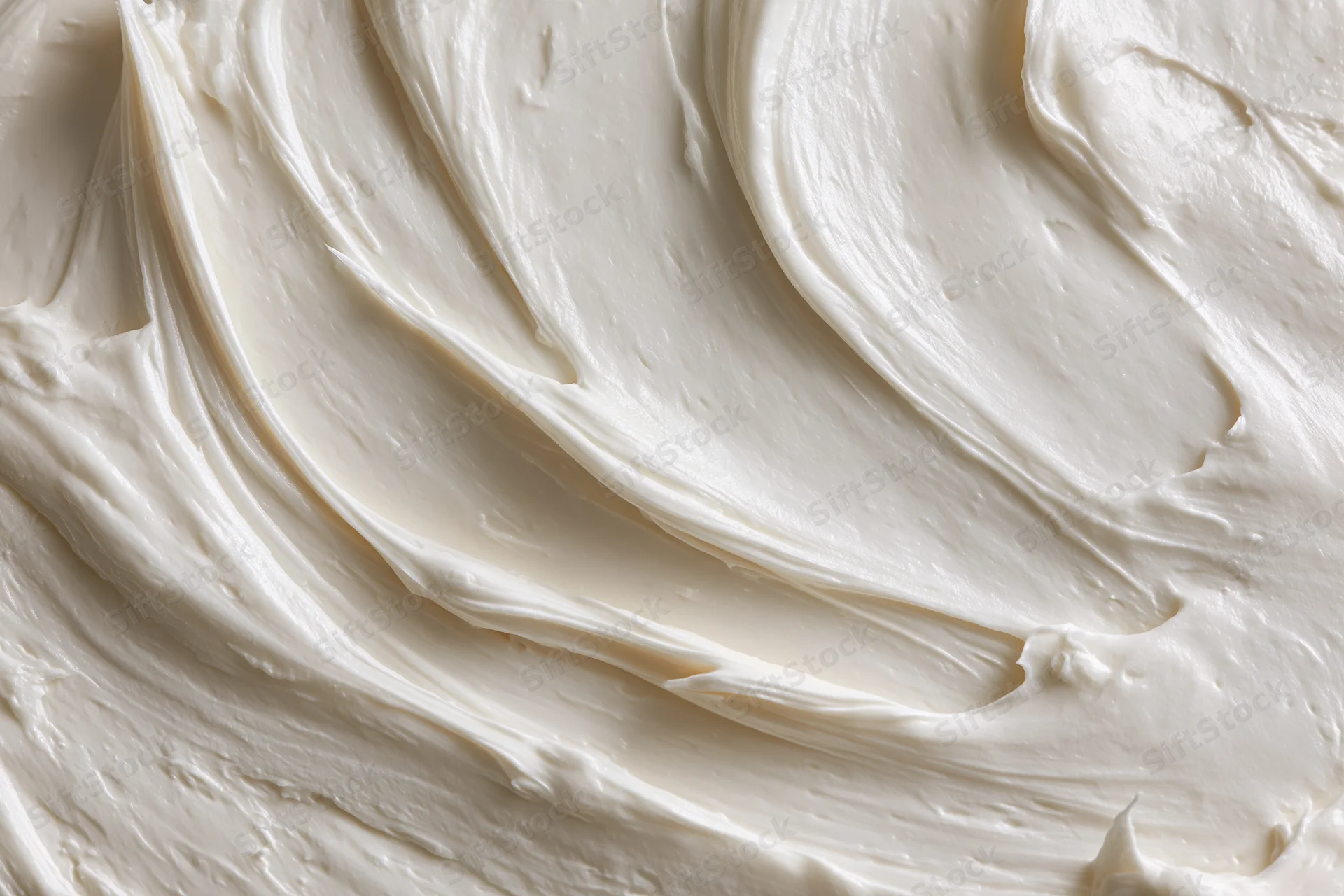 Close-up of smooth white cream with swirled texture