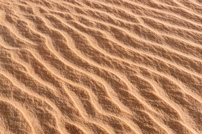 Close-up of rippled sand surface in desert landscape