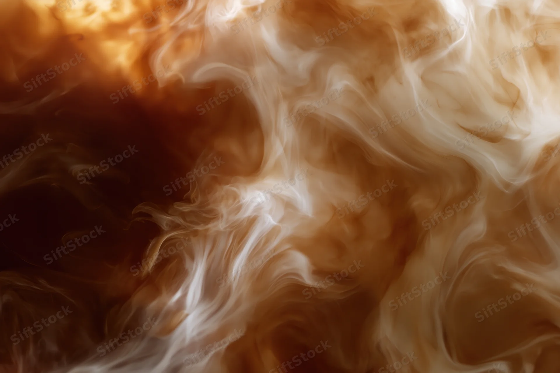 Swirling steam rising from coffee with cream dissolving into dark liquid