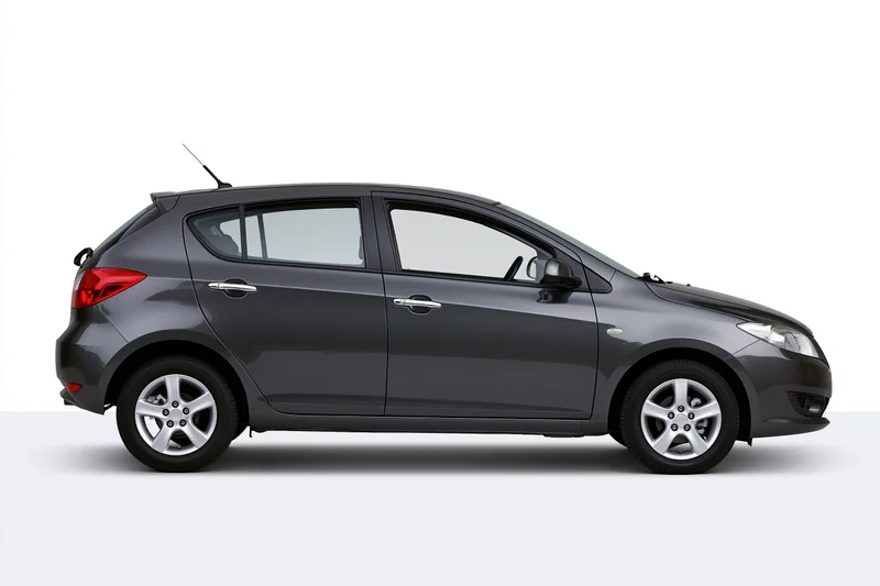 Dark gunmetal grey compact hatchback car shown in side profile against white background