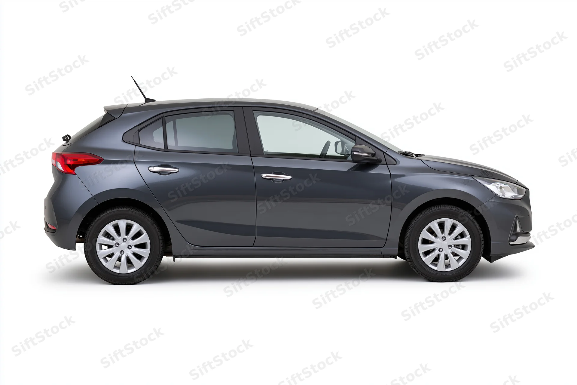 Dark gunmetal grey compact hatchback shown in side profile against white background