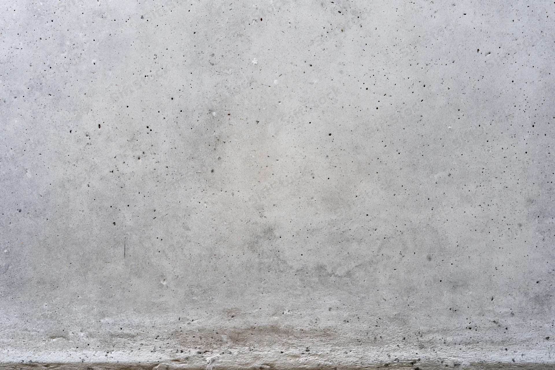 Closeup of a flat gray concrete wall surface filling the frame