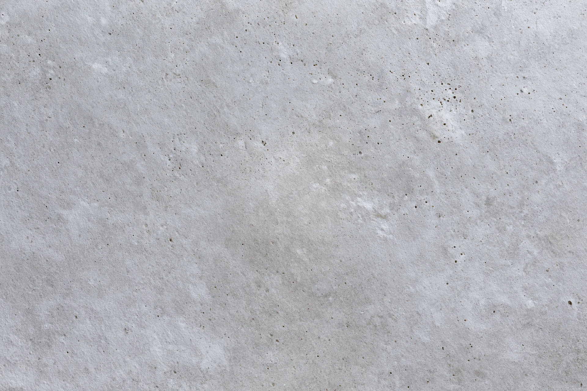 Close-up of a weathered concrete wall surface filling the frame