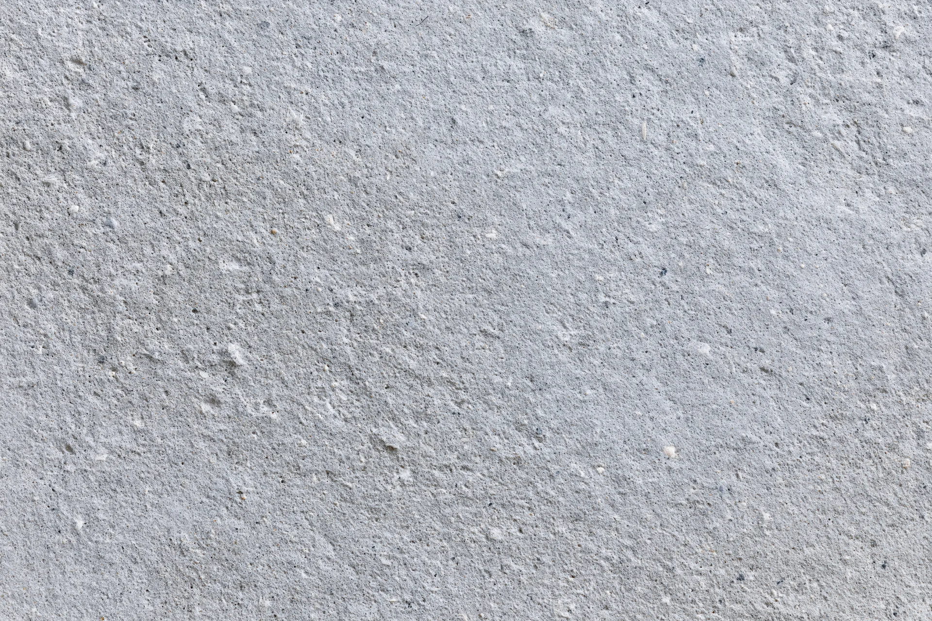 Closeup of a rough gray concrete wall surface filling the frame