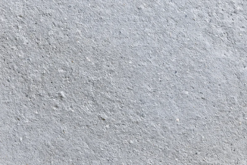 Closeup of a rough gray concrete wall surface filling the frame