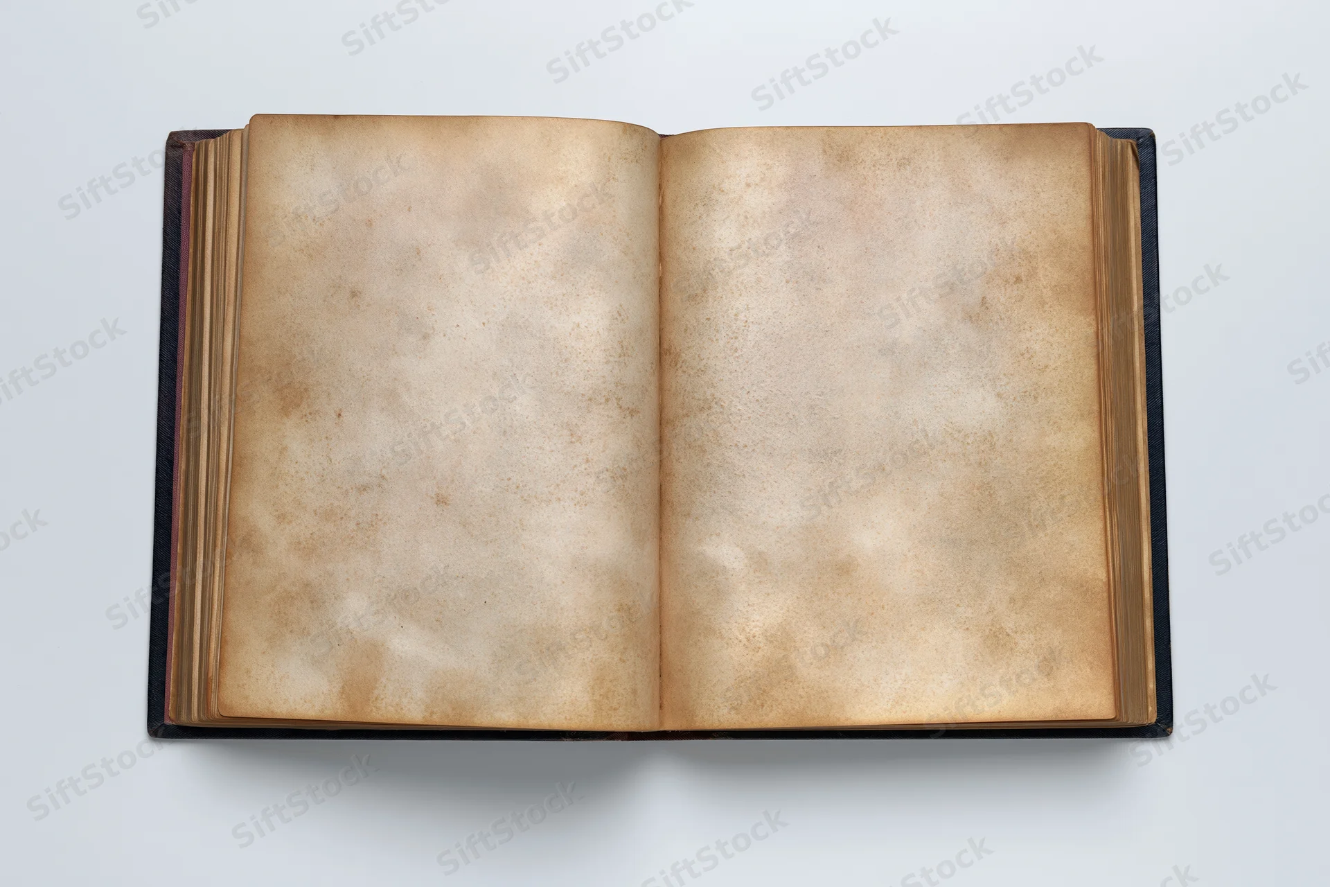 Open vintage hardcover book with blank aged pages on white surface