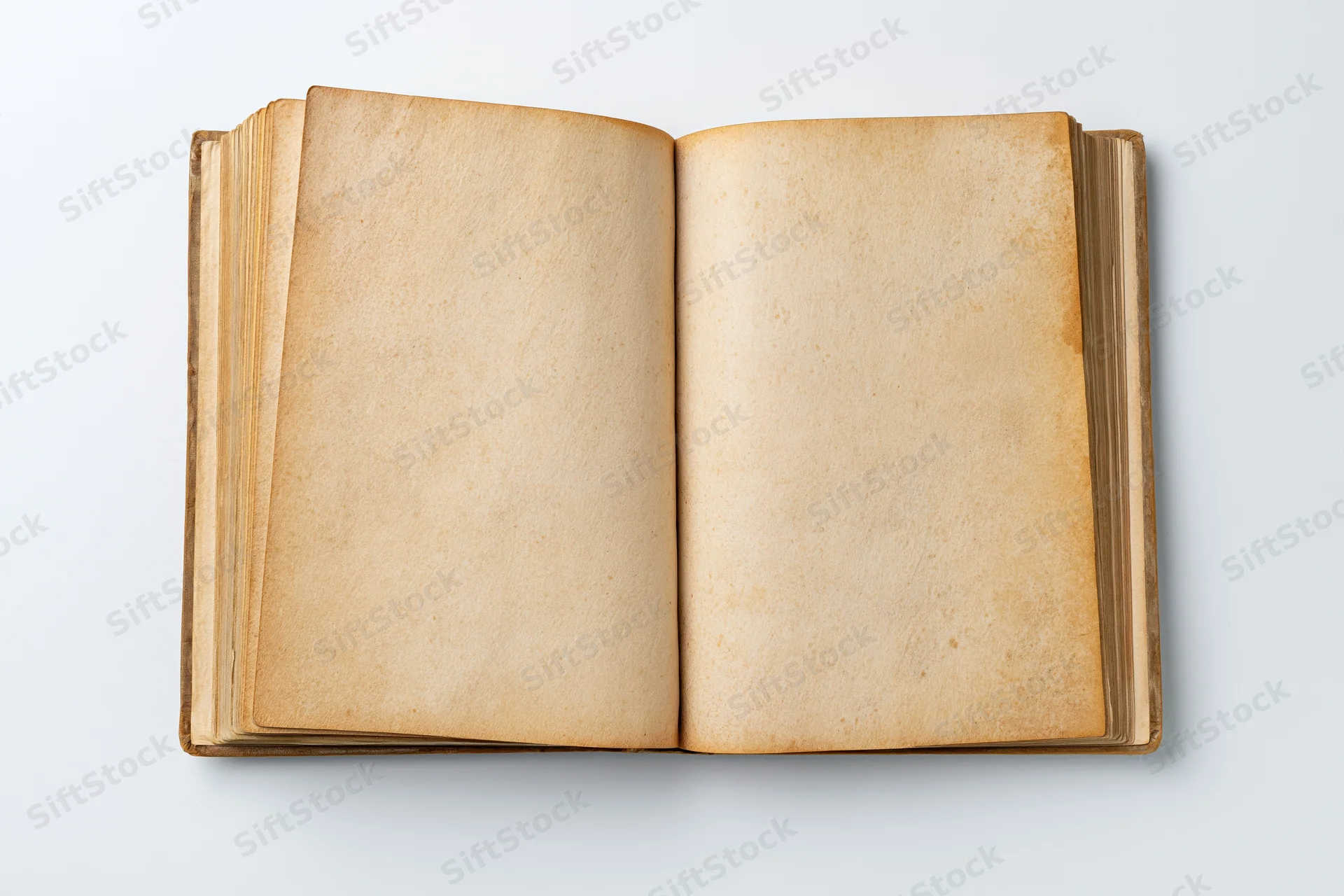 Open vintage hardcover book with blank aged pages on white background
