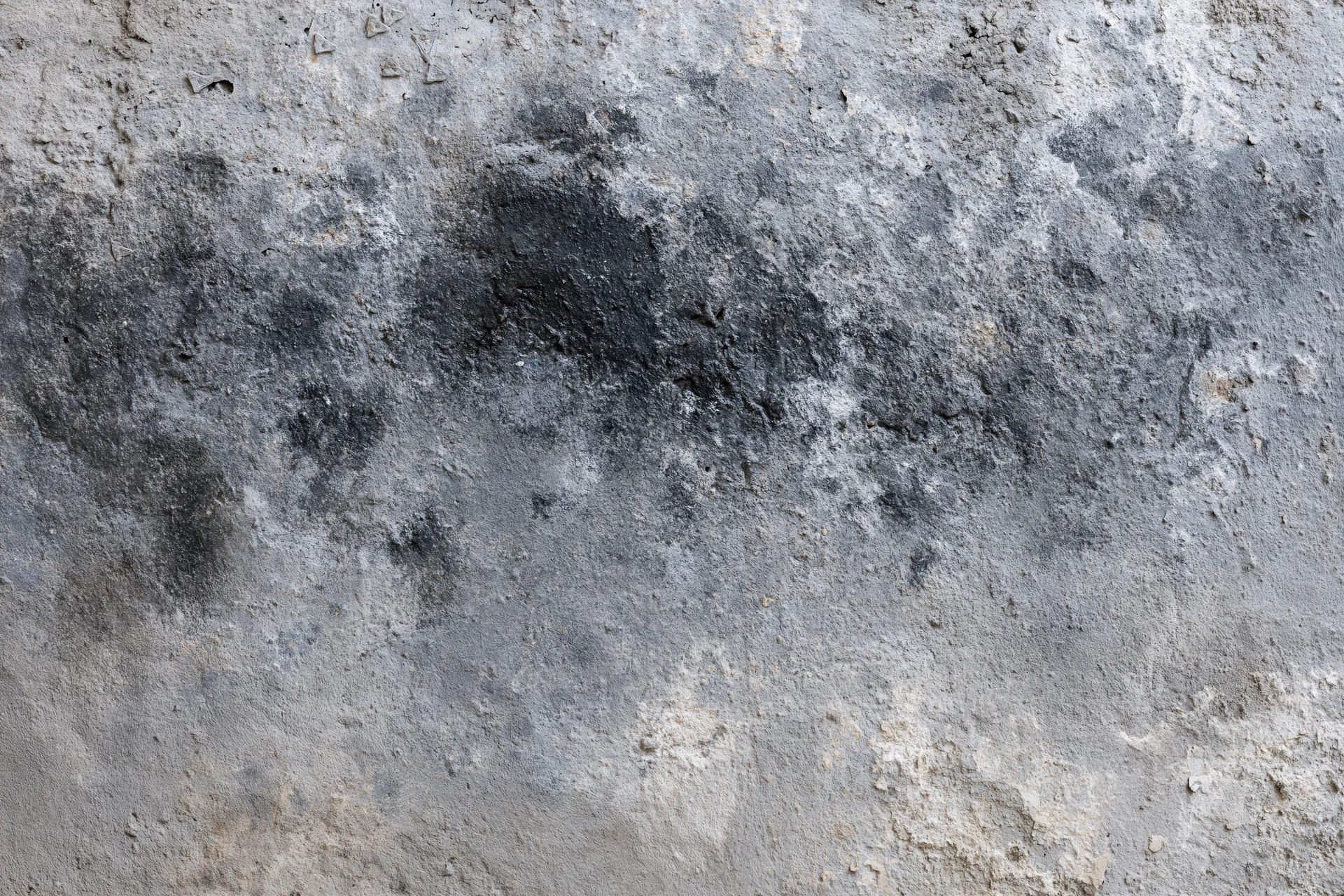 Weathered concrete wall surface filling the frame