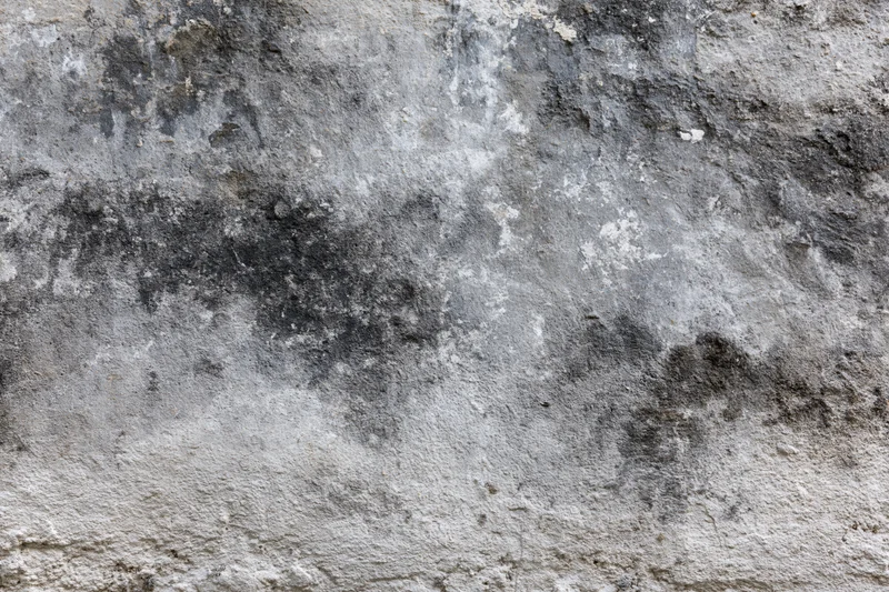 Weathered concrete wall surface filling the frame