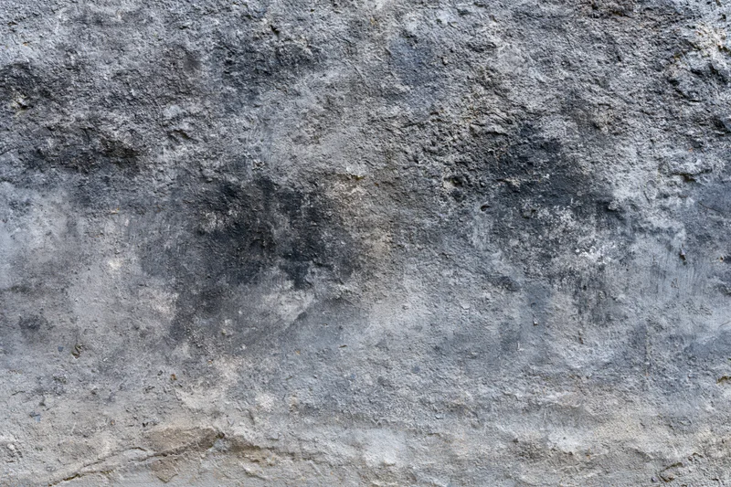 Weathered concrete wall surface filling the frame