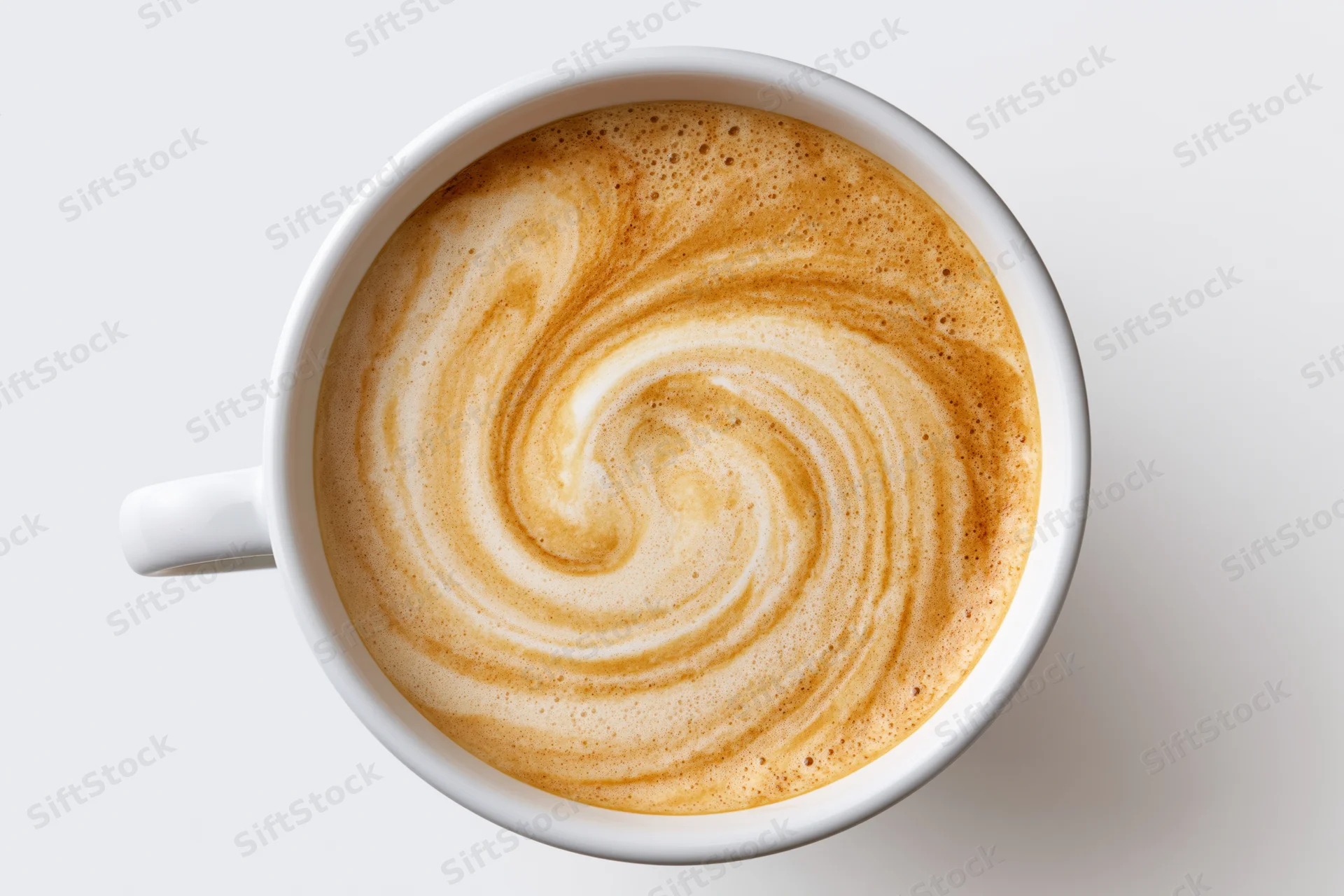 Overhead view of a white ceramic coffee cup filled with latte art swirl on a plain white surface