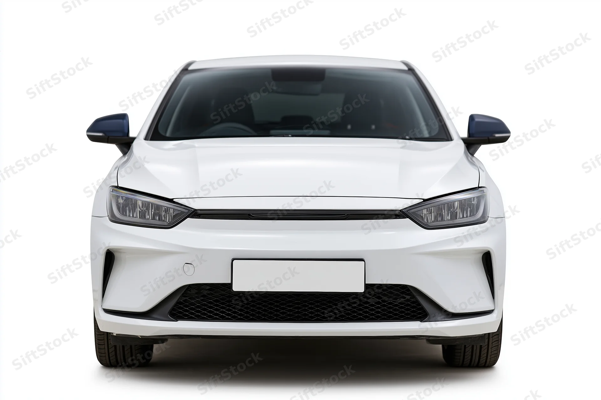 White modern electric sedan viewed straight-on from front against plain white background