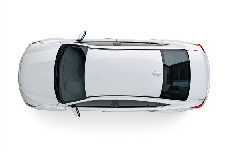 White sedan viewed from directly above against a plain white background