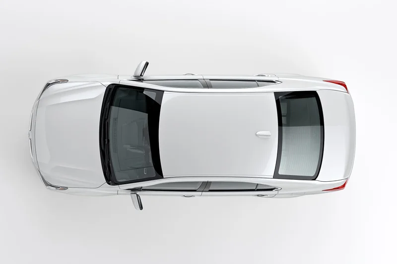 White sedan viewed from directly above against a plain white background
