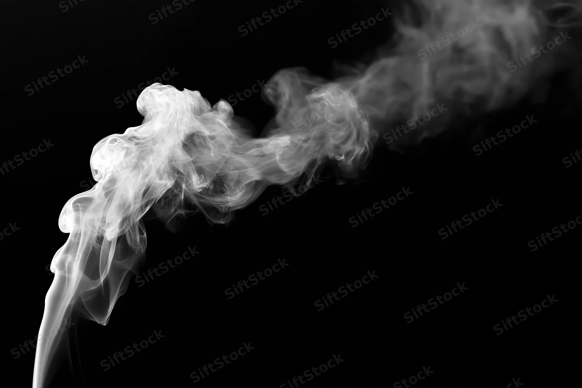 White smoke curling upward against a black background