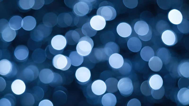 Blurred blue circular lights creating a festive abstract background