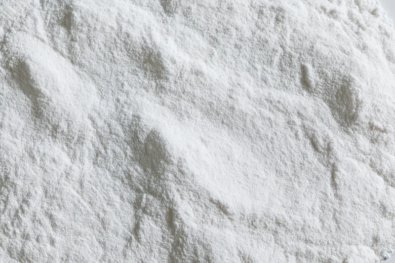 Closeup of white powder pile showing fine granular texture