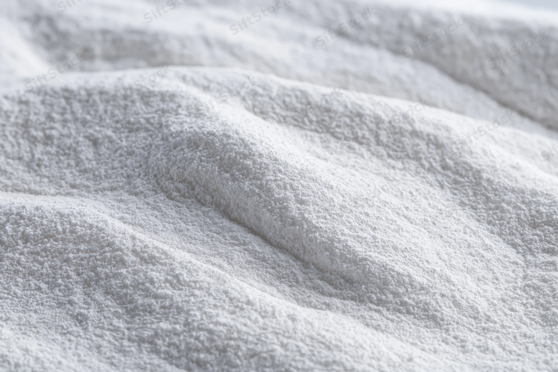 Closeup of white cotton towel with soft plush texture and gentle folds