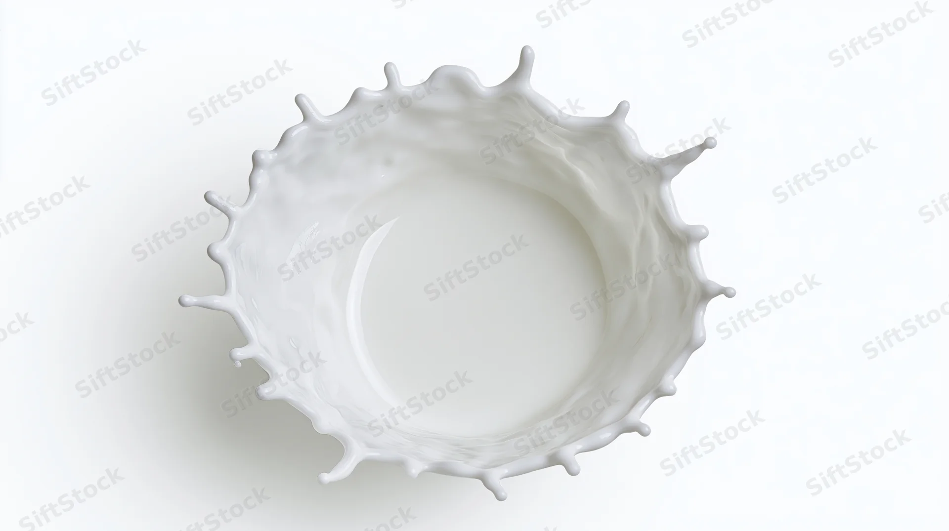 Milk splash frozen in motion against white background
