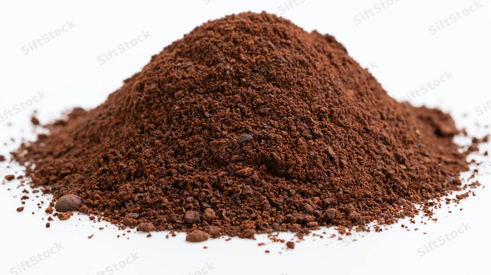 Heap of ground coffee powder on white background