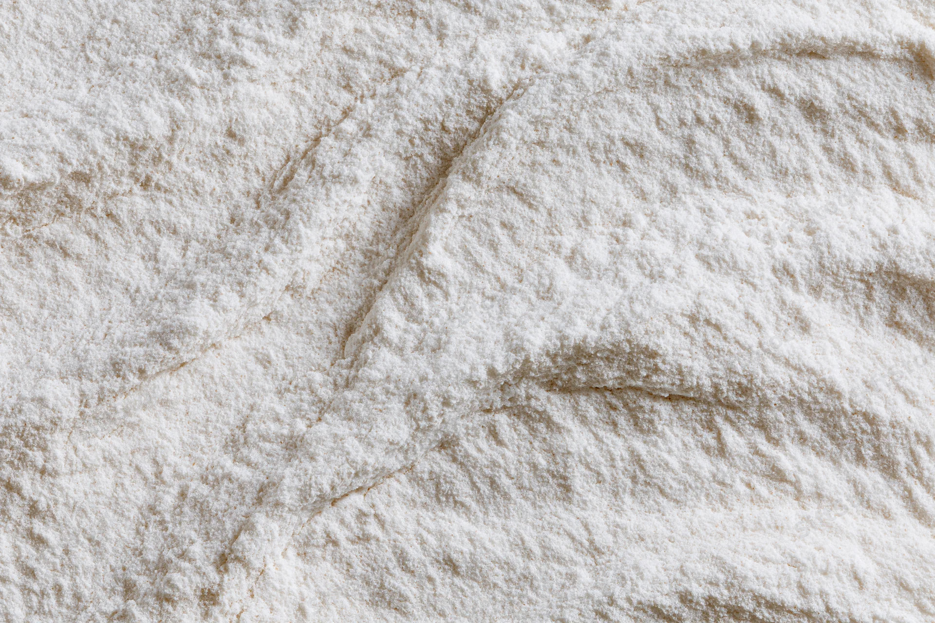 Closeup of white flour powder texture with soft undisturbed surface