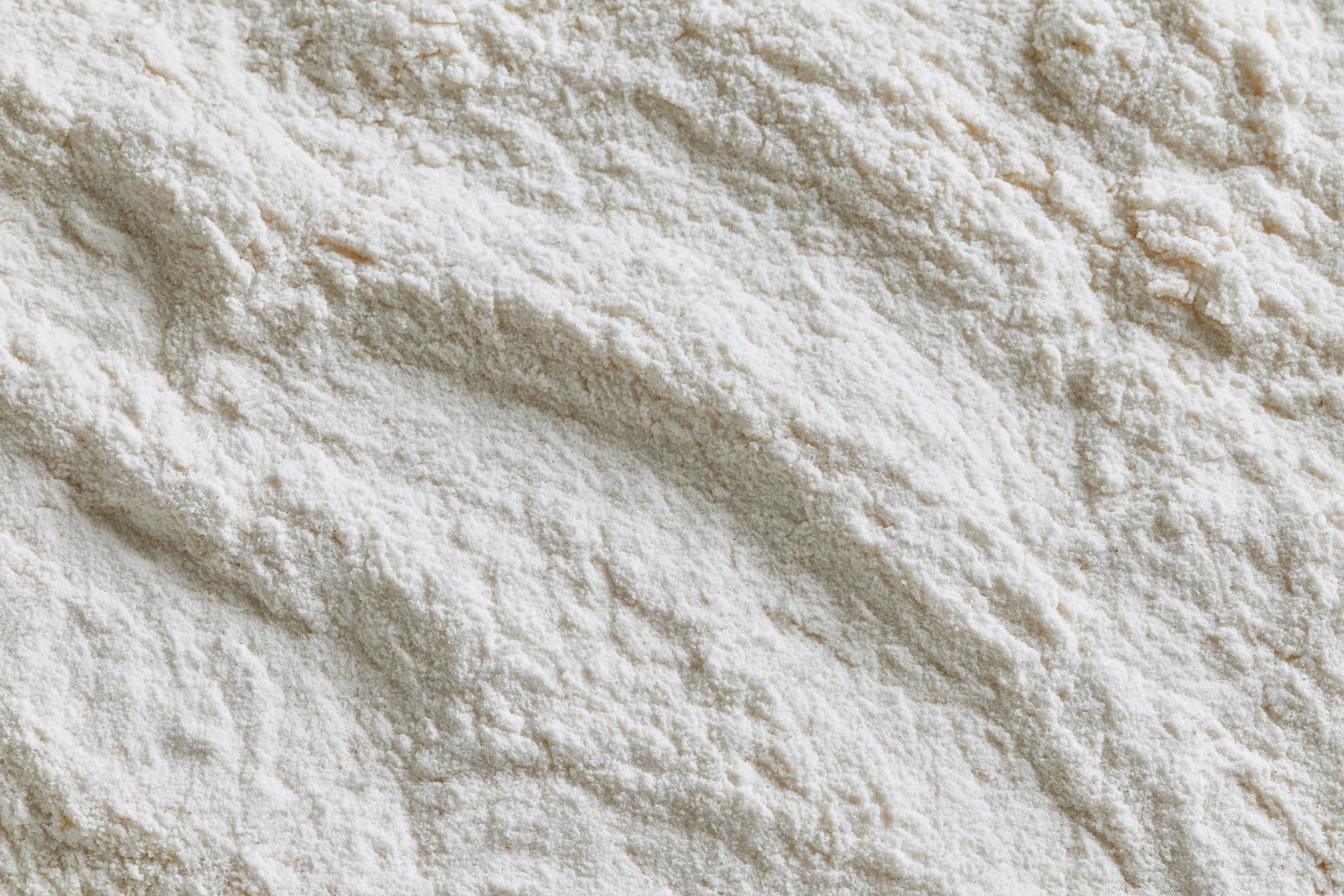 Closeup of white flour powder texture filling the frame