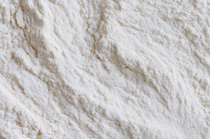 Closeup of white flour pile showing fine powdery texture