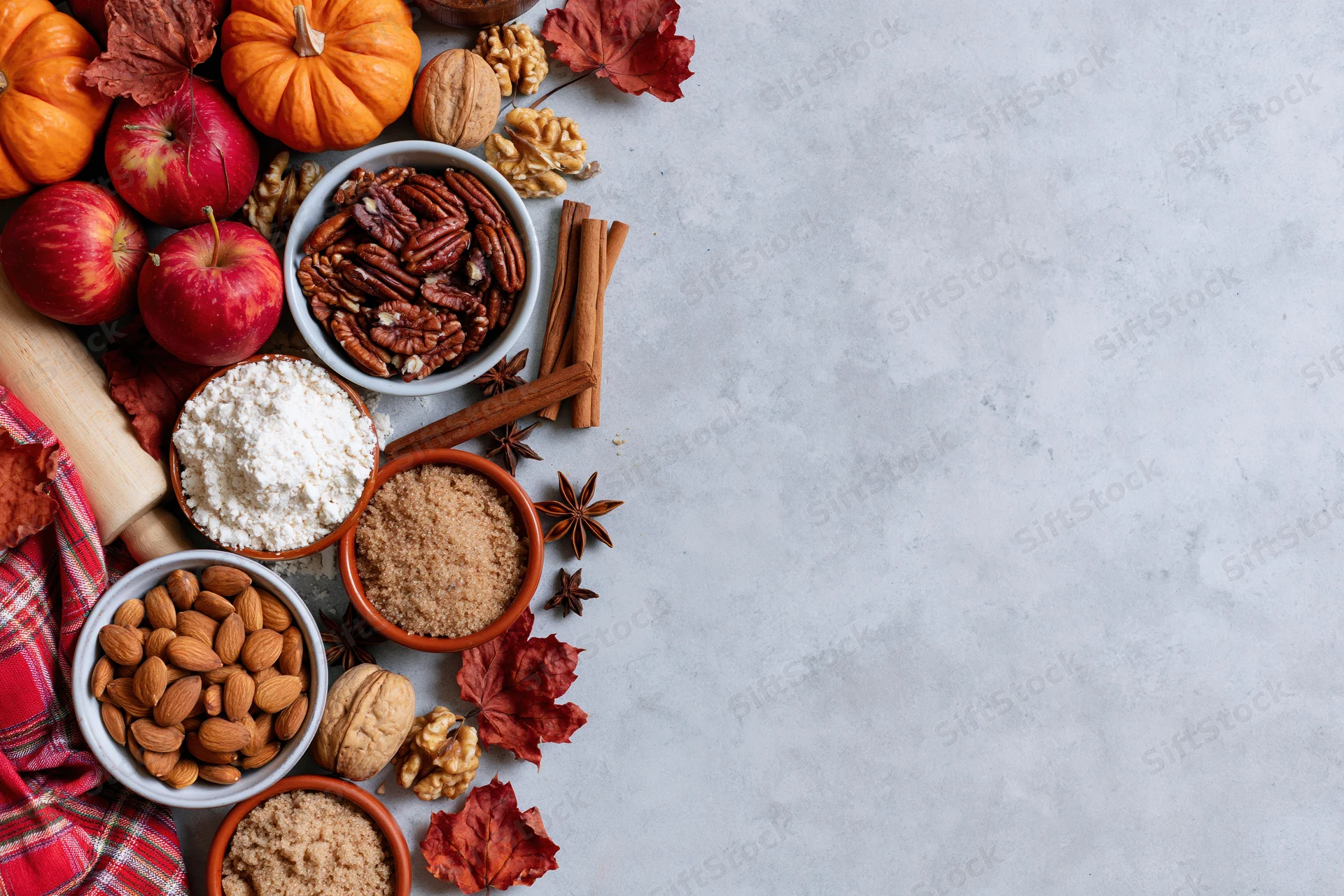 Autumn baking ingredients arranged on a table with copyspace