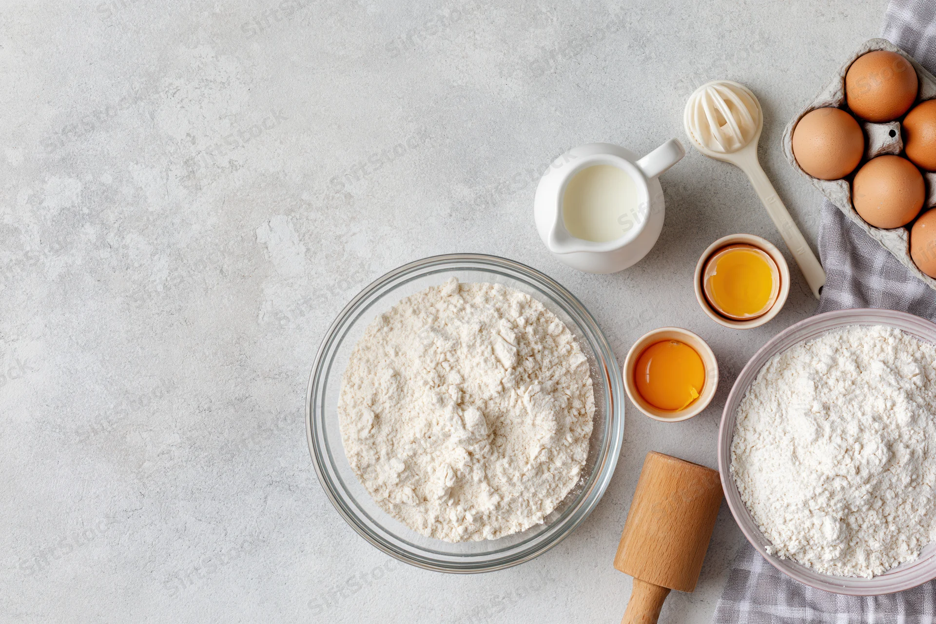 Baking ingredients arranged on a countertop with copyspace