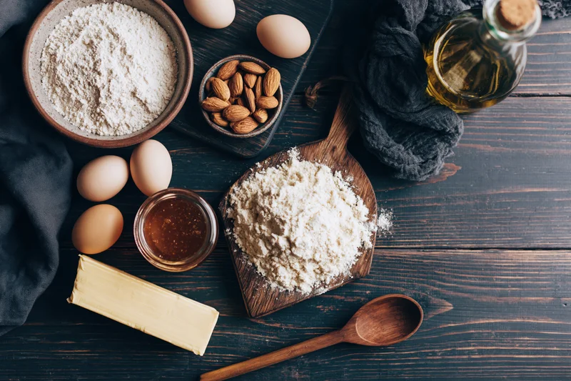 Flour Display Rustic Baking Essentials On A Dark Wooden Tabl