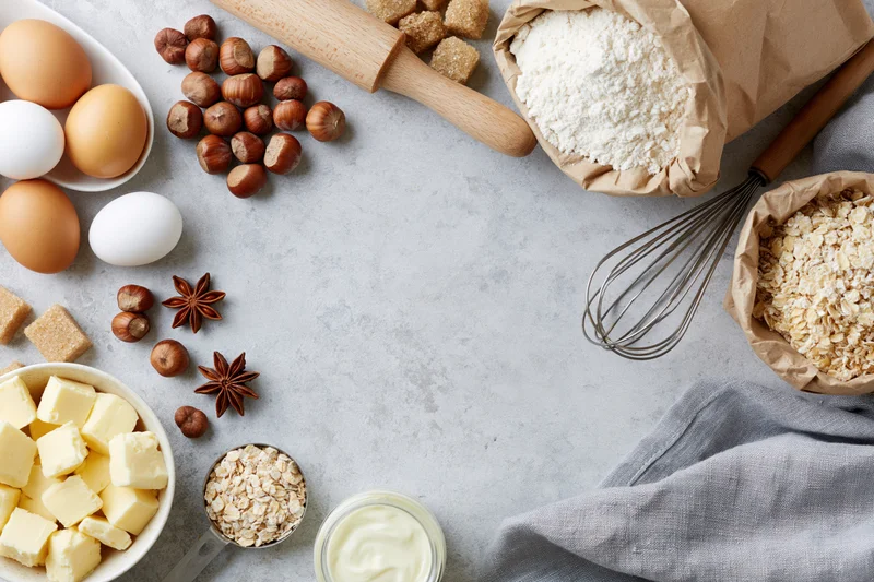 Baking ingredients arranged on a countertop with copyspace