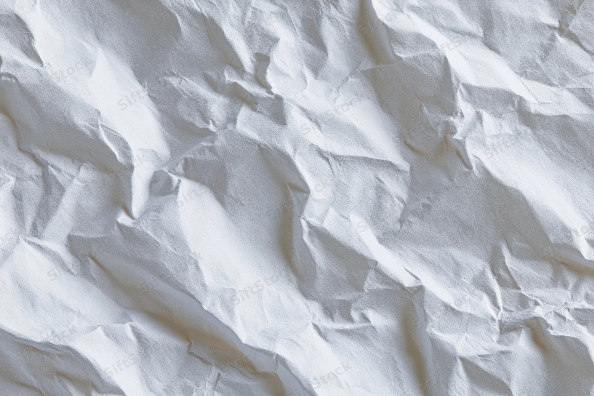 Crumpled white paper texture filling the frame