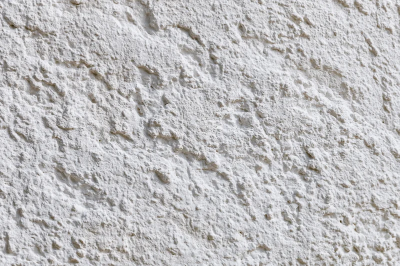 Close-up of textured white plaster wall surface