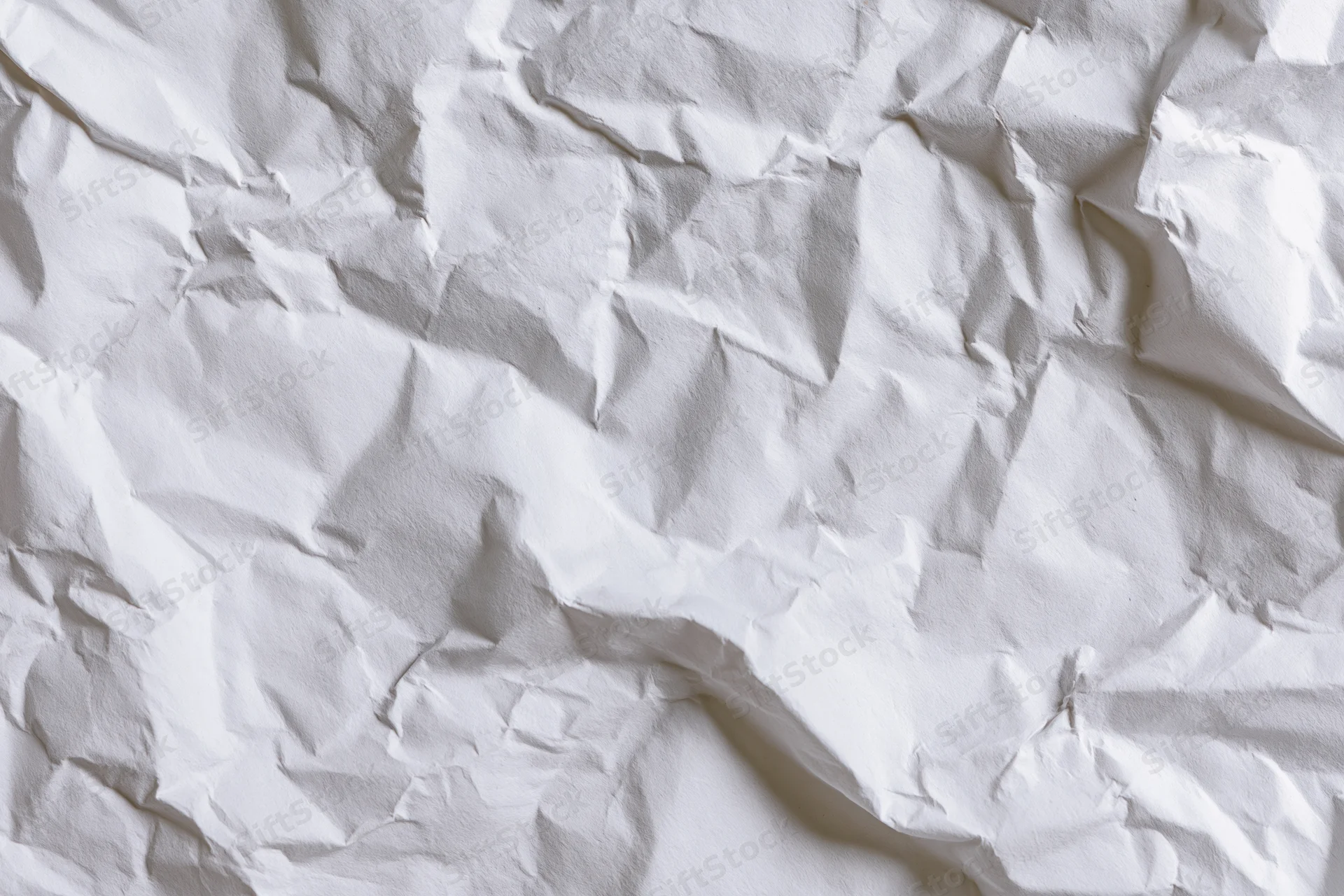 Crumpled white paper texture filling the frame