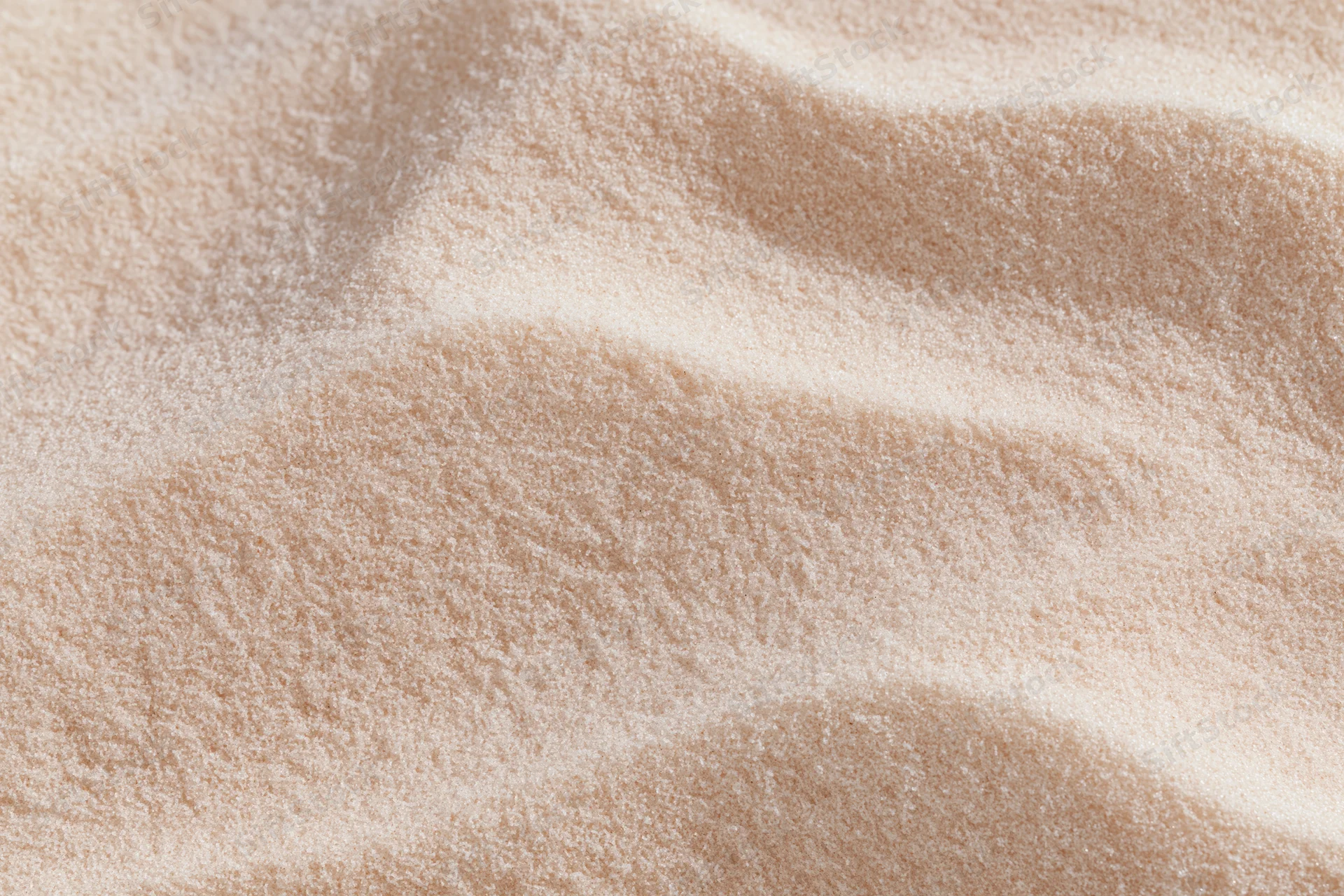 Closeup of beige plush fabric with soft texture and gentle folds