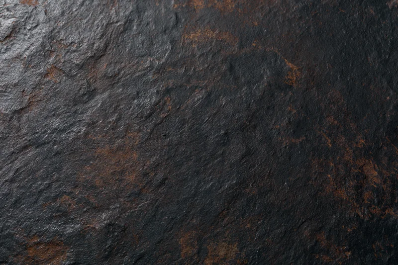 Close-up of rusted metal surface showing weathered texture and corrosion patterns