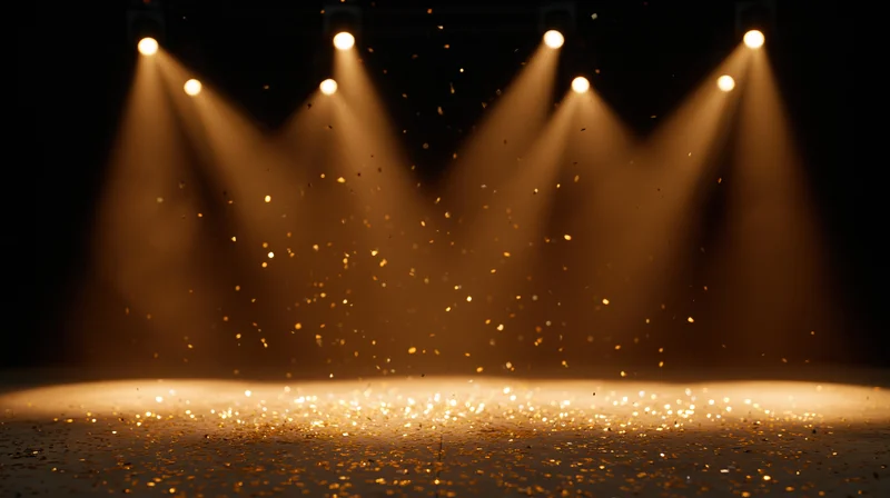 Stage lit by spotlights with golden sparkles falling on the floor