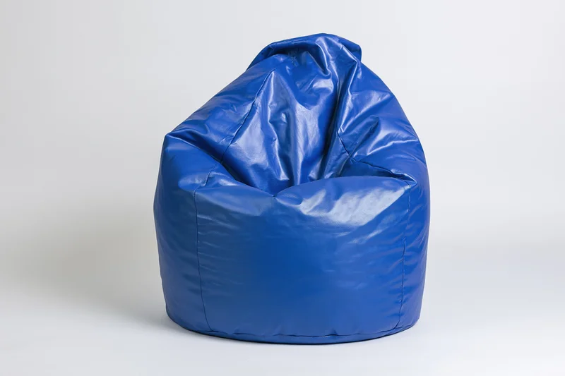 Blue vinyl bean bag chair sitting upright on plain white background