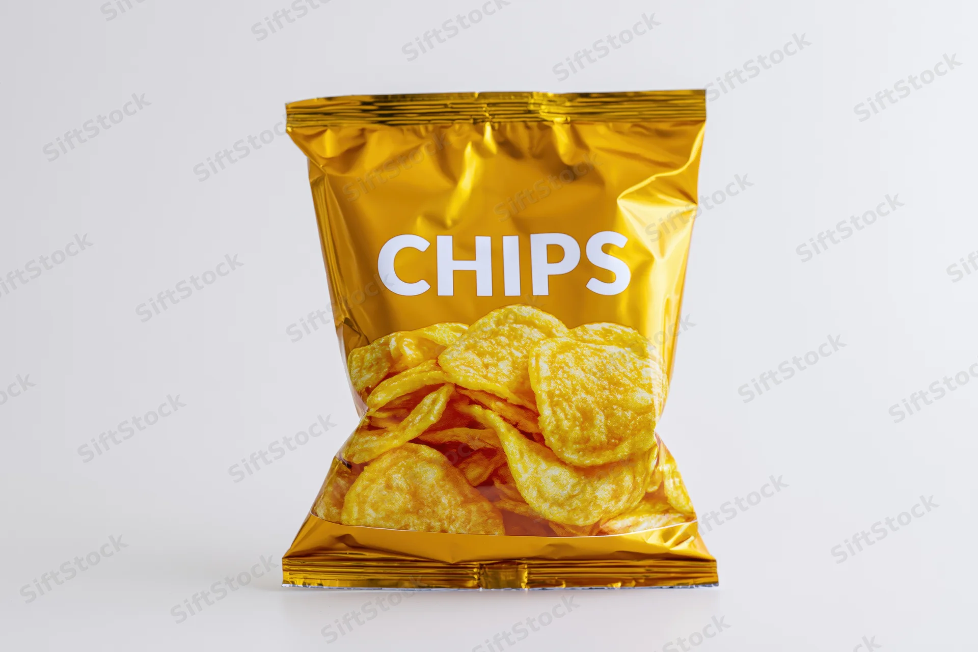 Sealed golden foil bag of chips with transparent window on white background