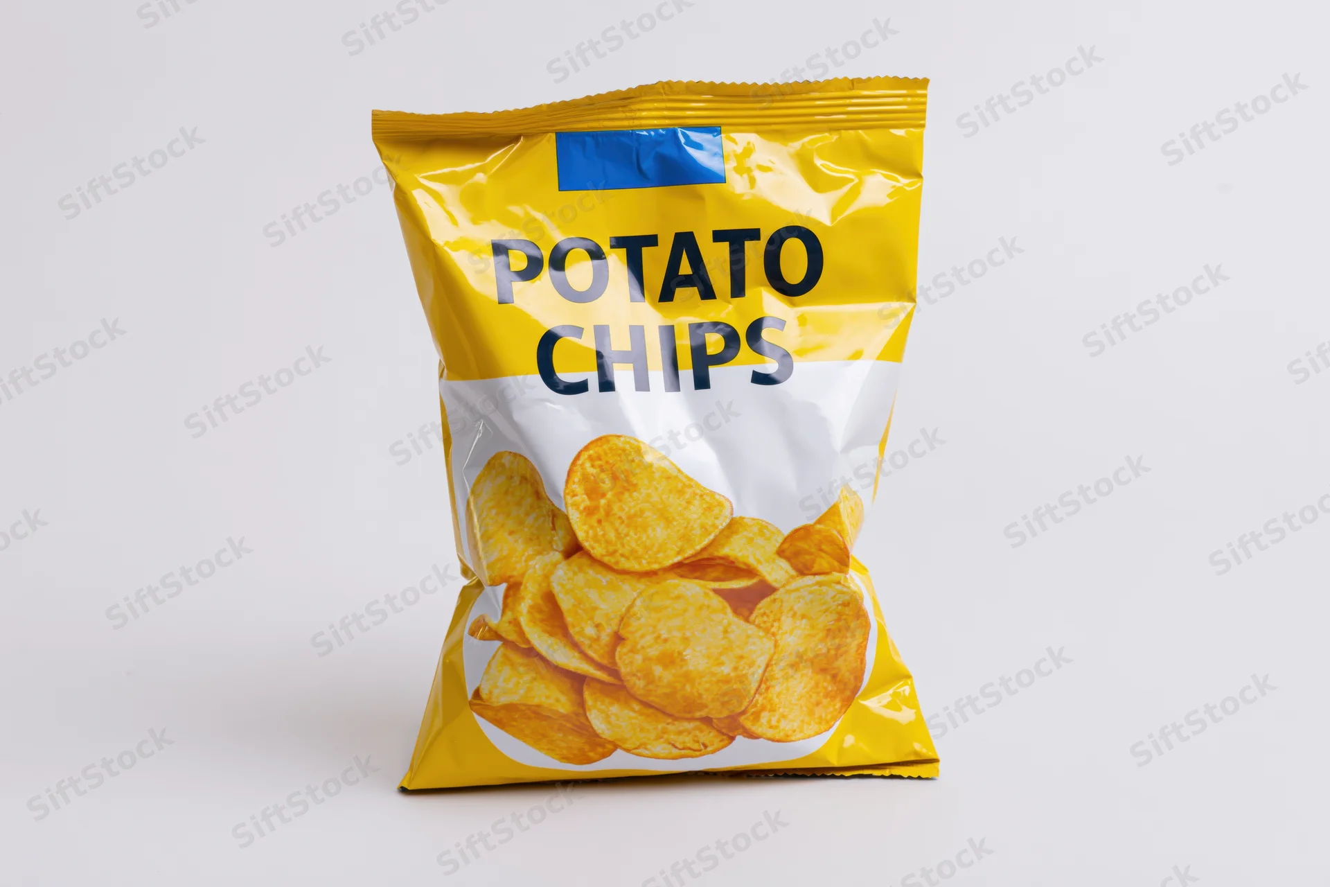 Sealed bag of potato chips standing upright centered on white background