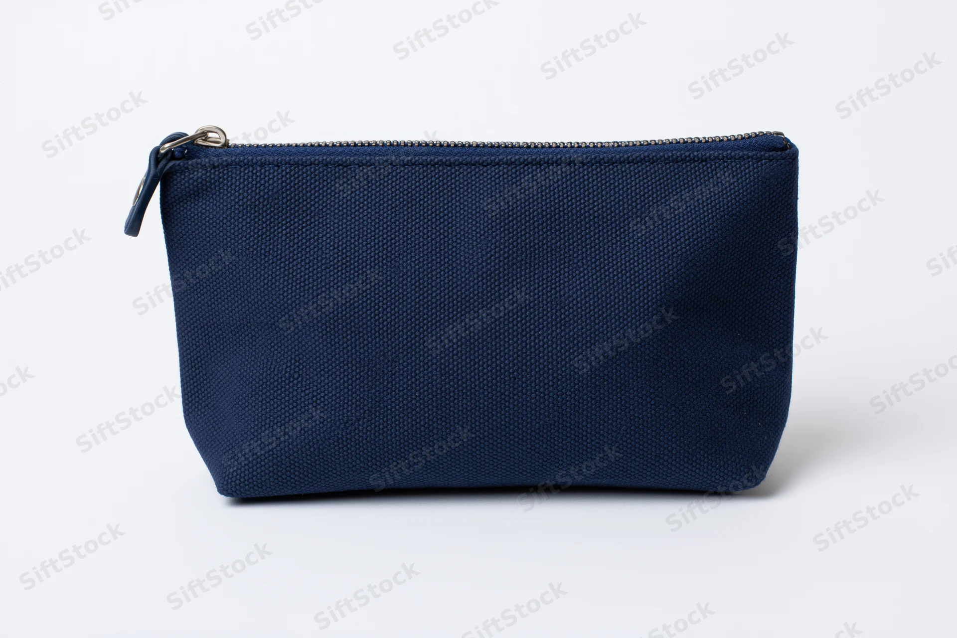 Navy blue canvas cosmetic pouch with top zipper on white background