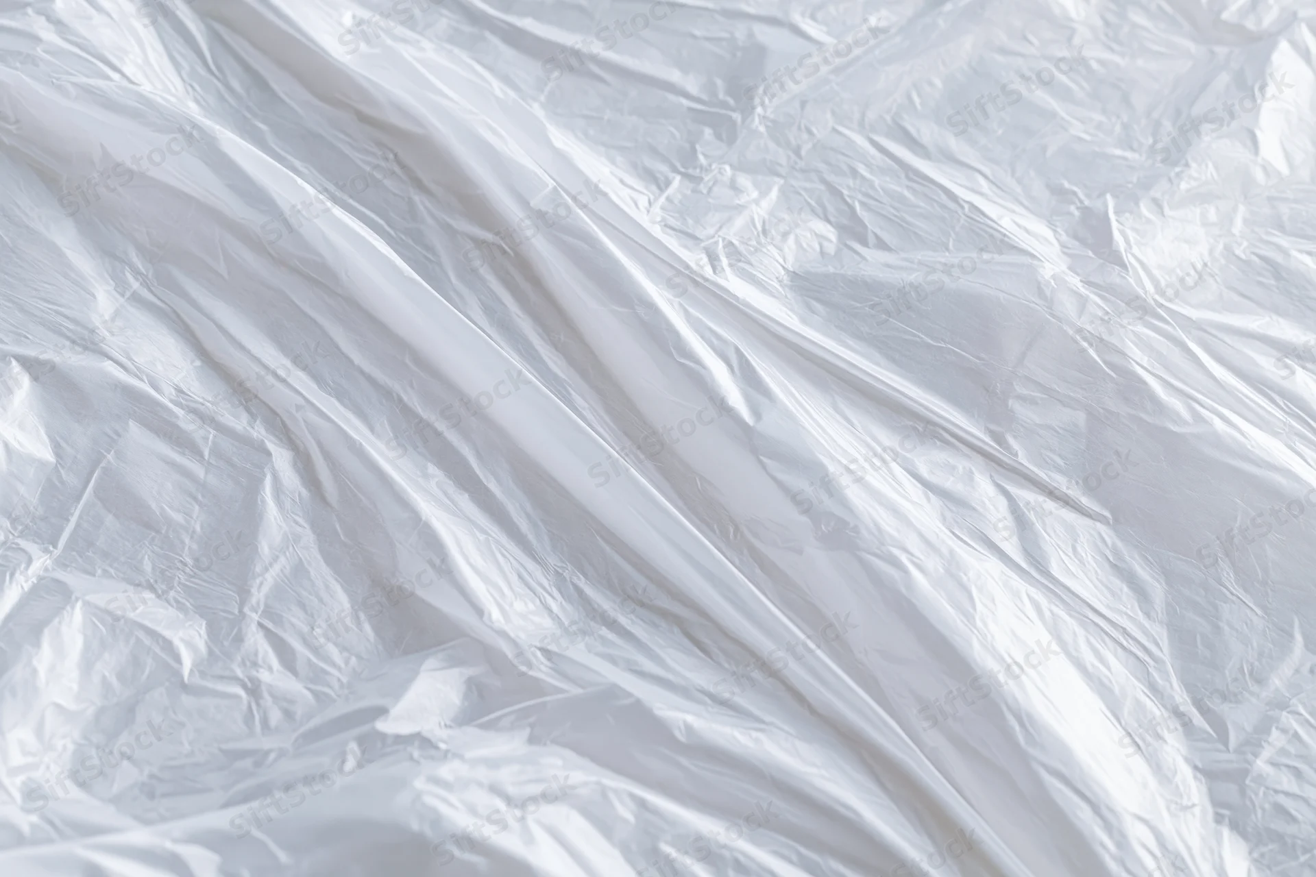 Crumpled transparent plastic wrap filling the frame as a textured surface