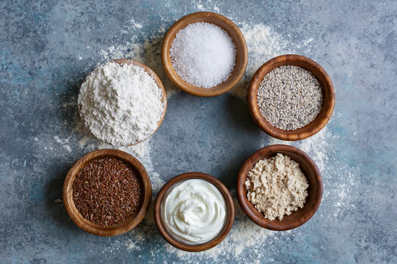 Baking ingredients arranged in a ring on a stone countertop